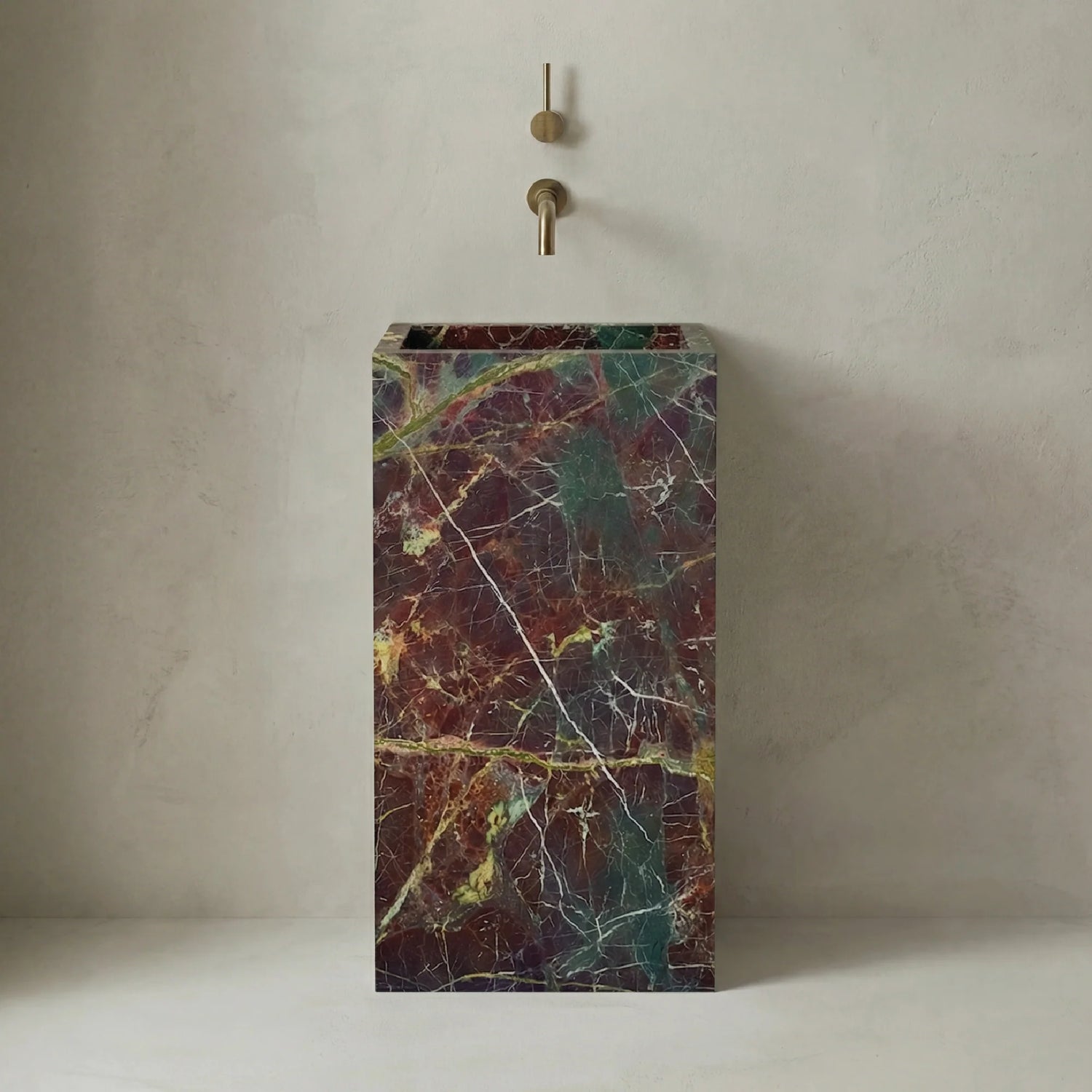 Totem Serene washbasin in Granada Quartzite without tap hole, luxury reddish natural stone.