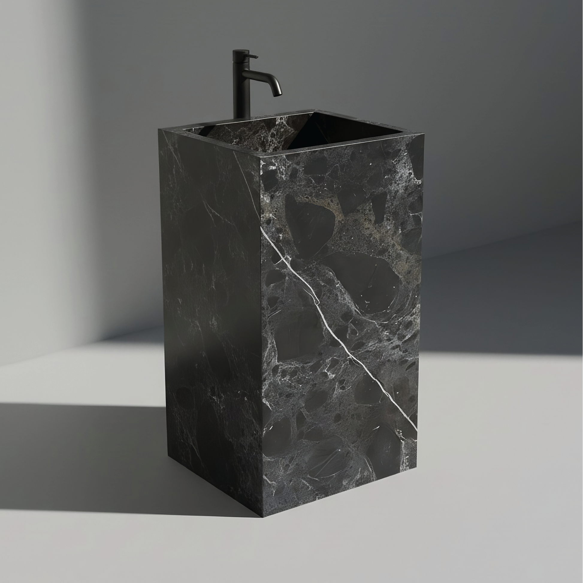 Lavabo Totem Seren en Mármol Negro Casper sin agujero para grifo, diseño monolítico de piedra natural para baños de lujo.