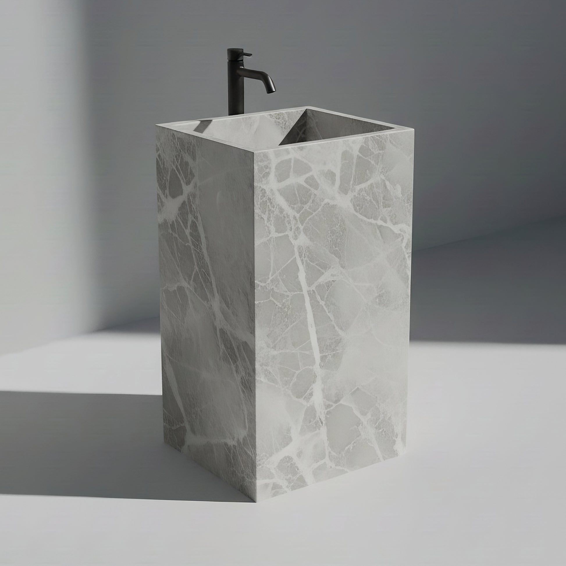 Lavabo Totem Seren en Mármol Tundra Grey sin agujero, acabado pulido de piedra natural gris.