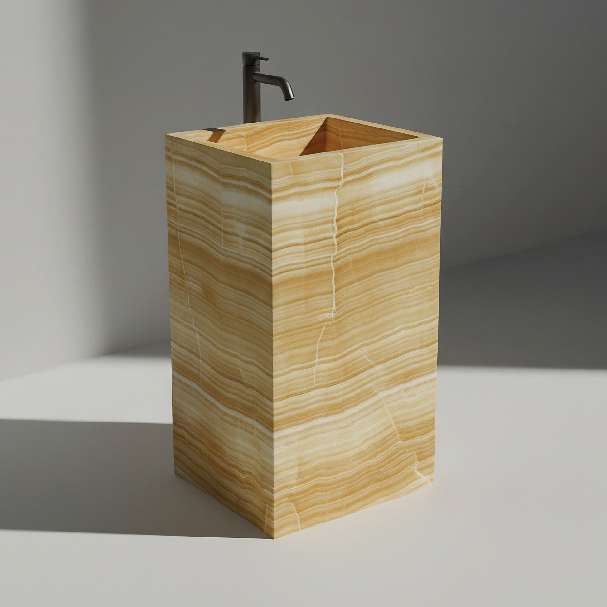 Lavabo Totem Seren en Ónix Dorado sin agujero, piedra semipreciosa pulida de tonos cálidos y dorados.