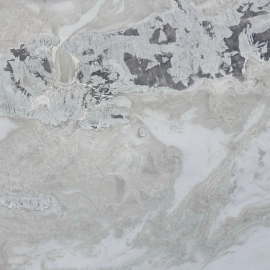 Detail of Dover Marble, polished clear surface with discreet veins and natural texture.