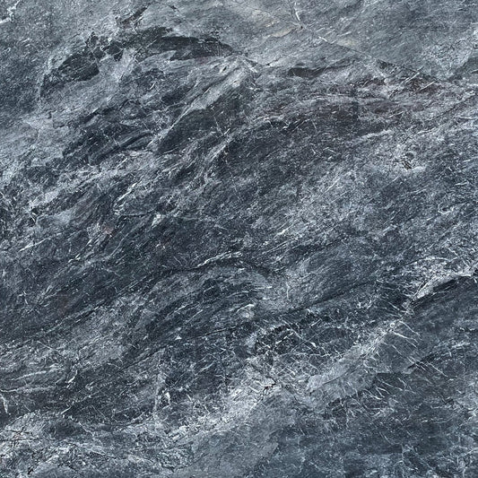 Detail of Iris Marble, soft veins and polished texture in light natural stone.