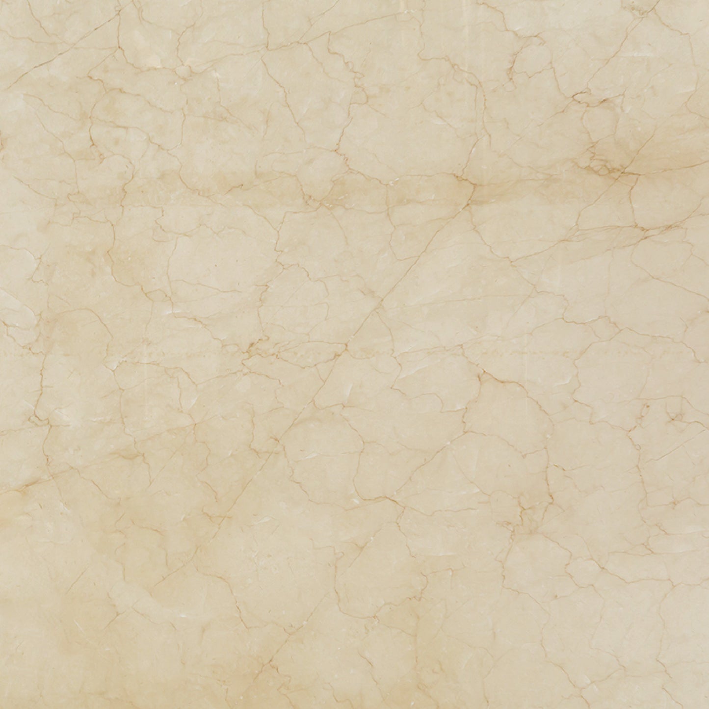 Detalle del mármol Crema Persa mostrando su textura natural, vetas cálidas y acabado pulido.