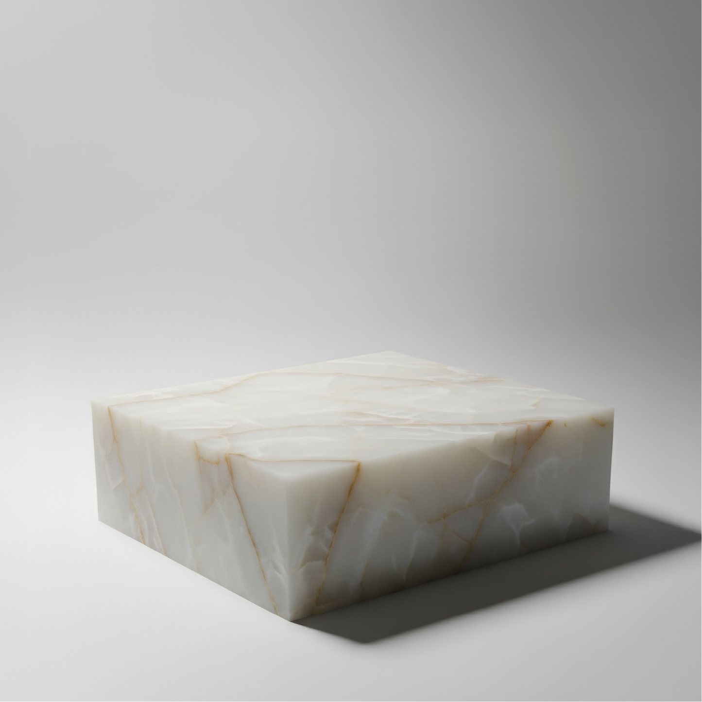 Mesa centro The Cube en Ónix Blanco con diseño cúbico y acabado pulido.